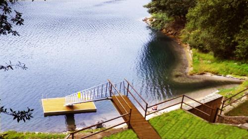 a staircase leading into a body of water at Agrinho Suites & Spa Gerês in Valdosende