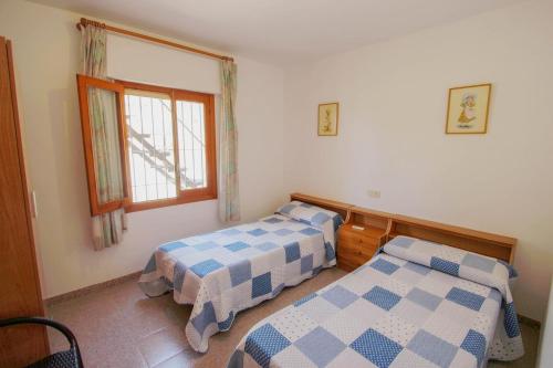 En eller flere senge i et værelse på Finca Alhambra - spacious and characterful property in Benissa