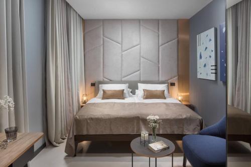 Postel nebo postele na pokoji v ubytování Terra Residence