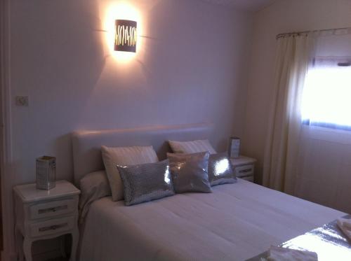 a bedroom with a bed with pillows on it at Villa Zen in Narbonne