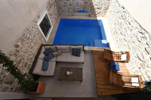 an overhead view of a swimming pool in a house at Kuća Dida Grga in Murter