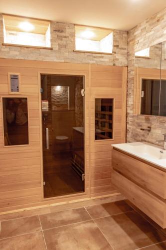 a bathroom with a sink and a shower and a tub at casa Heemskerk in Noordwijk