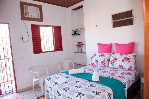 En eller flere senge i et værelse på Excelente Apartamento - Família Mangas Monteiro