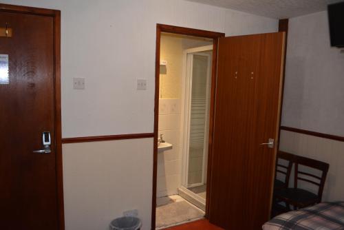 an open door to a room with a bedroom at BLACKPOOL MERCY Inn HOTEL in Blackpool