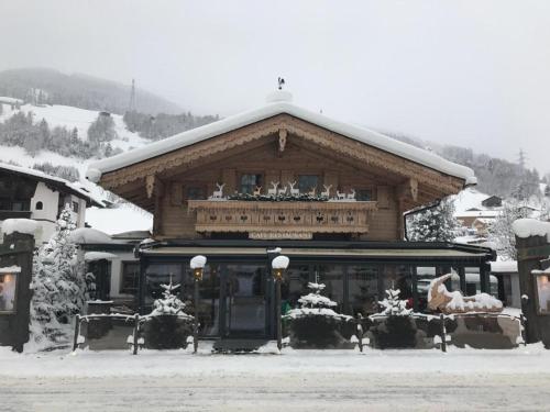 a building with snow on top of it at Das Landhaus in Gerlos