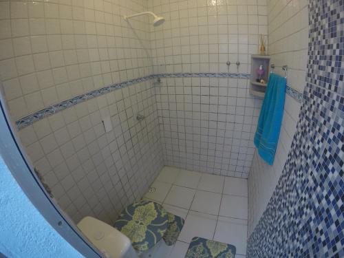 a bathroom with a shower with a toilet in it at Casas Maragogi 2 in Maragogi