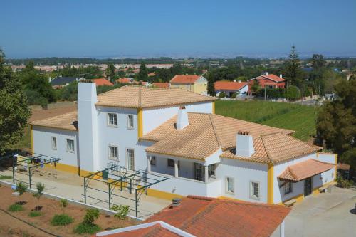an aerial view of a house with orange roofs at Casal dos Cantos in Quinta do Anjo