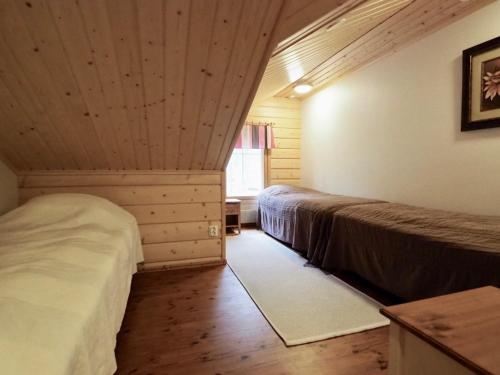 Giường trong phòng chung tại Levillas Adjutantti A&B Villas