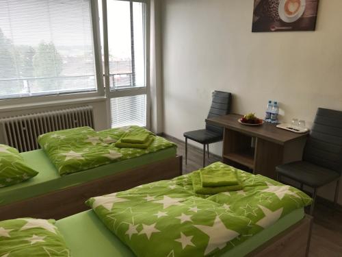 Ένα ή περισσότερα κρεβάτια σε δωμάτιο στο Ubytovanie Novohrad