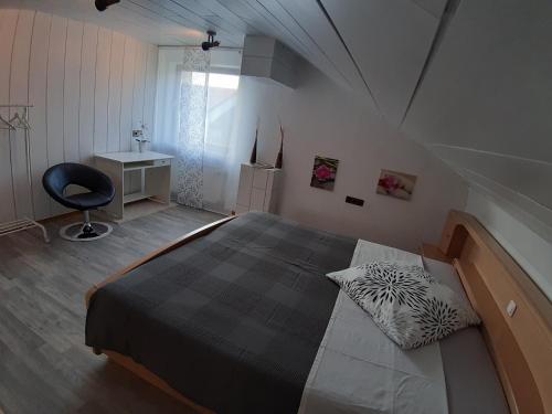 מיטה או מיטות בחדר ב-Thuja am Weinberg