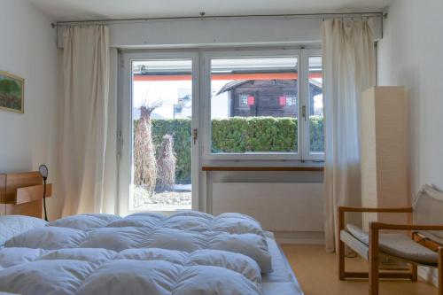 Postel nebo postele na pokoji v ubytování Apartment in Casa Caral - Flims Waldhaus
