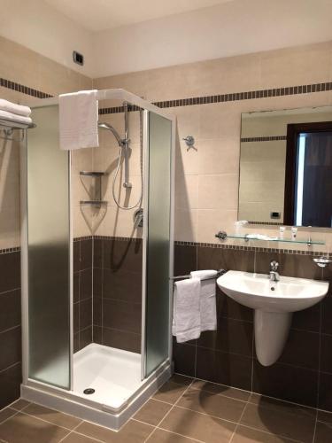 a bathroom with a shower and a sink at Isola di San Servolo - Centro Soggiorno in Venice