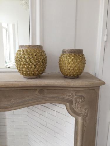 two vases sitting on top of a table at Au Cœur De Lille in Lille