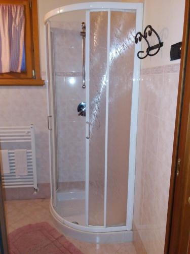 a shower with a glass door in a bathroom at B&B Al Tramonto in Monzambano