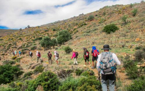 a group of people walking up a hill at Dar Ajgal in Dourtane