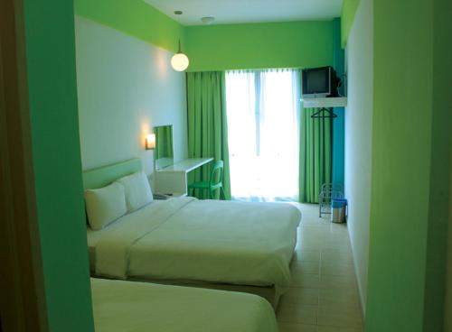Postel nebo postele na pokoji v ubytování YY38 Hotel