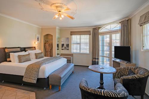 Postel nebo postele na pokoji v ubytování Silver Fern Rotorua Suites & Spa