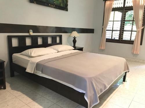 Mangga Bali Inn 객실 침대