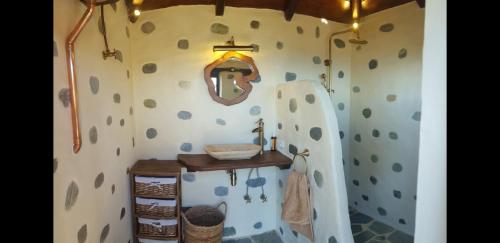 a bathroom with a shower with a sink in it at Archontiko Mansion Porteli Αρχοντικο Πορτελι in Makrinítsa