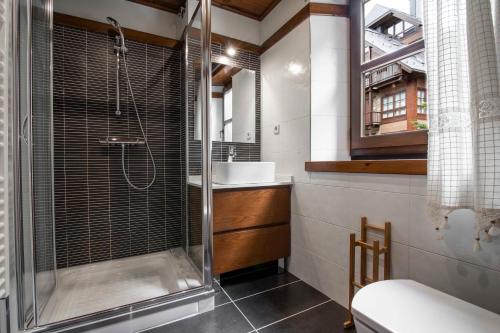 a bathroom with a shower and a sink at ARTIGA de Alma de Nieve in Baqueira-Beret