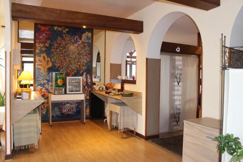 a kitchen with arches and a dining room at Bergerie du Château - Lacapelle Marival in Lacapelle-Marival
