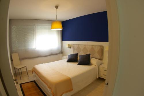 a bedroom with a large bed and a window at ¡¡NAUTILUS HIGH QUALITY!! in Carboneras