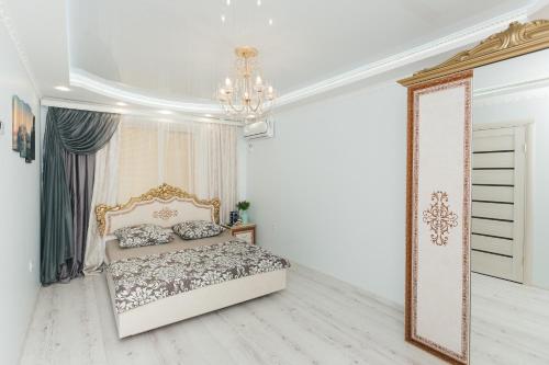 Ένα ή περισσότερα κρεβάτια σε δωμάτιο στο De LUXE apartments Centr 1 floor