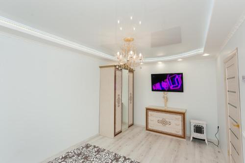 Μια τηλεόραση ή/και κέντρο ψυχαγωγίας στο De LUXE apartments Centr 1 floor