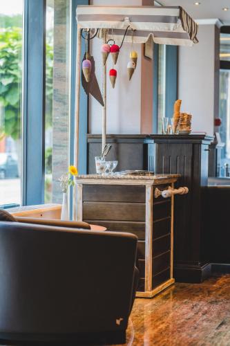 a restaurant with a bar with a counter with utensils at Budapest Hotel - Free Parking in Sofia