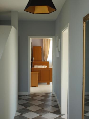 a hallway with a room with a bed and a ceiling at Wakacje u Babci Krysi in Górno
