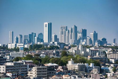 a city skyline with tall buildings in the background at the b sangenjaya in Tokyo