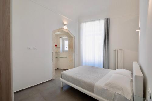 Posteľ alebo postele v izbe v ubytovaní Ortigia Fab Apartment