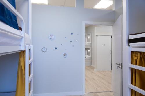 a room with bunk beds and a hallway at Dream in Santiago in Santiago de Compostela
