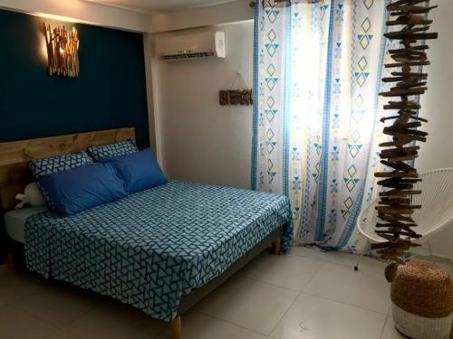 Llit o llits en una habitació de Sunset