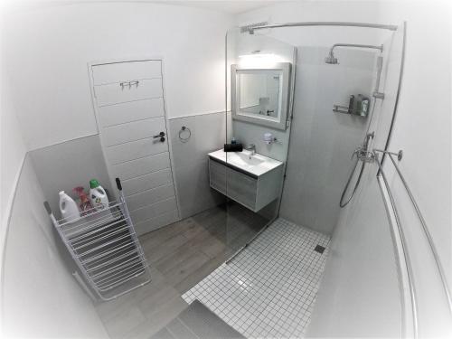 a small bathroom with a sink and a mirror at Disa Park 17th Floor Apartment with City Views in Cape Town