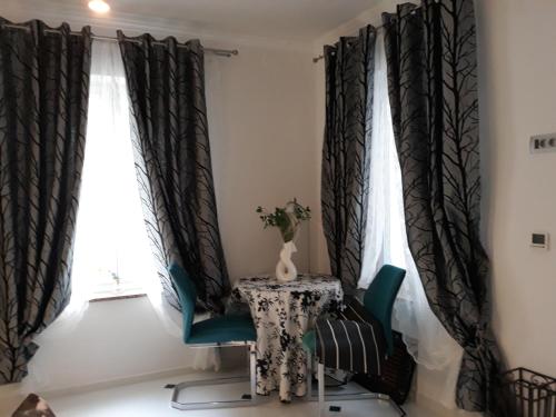 a table and chair in front of a window at App Paris 5 in Umag
