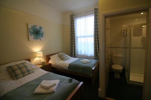 A bed or beds in a room at The Tennyson 