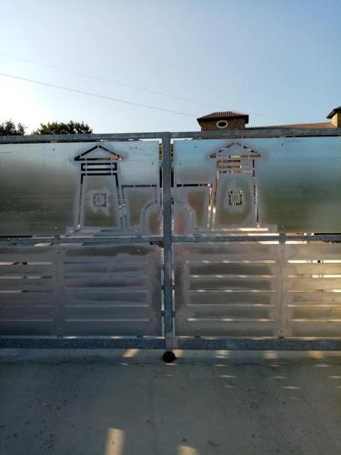 a metal trailer with doors on the side of a road at LE TORRI DEL CILENTO in Santa Maria di Castellabate