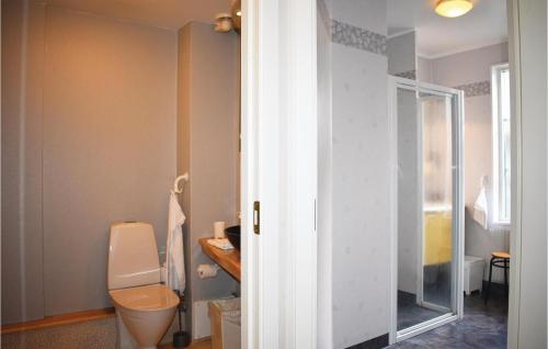 a bathroom with a toilet and a glass door at Nice Apartment In Karlskrona With 2 Bedrooms And Wifi in Karlskrona