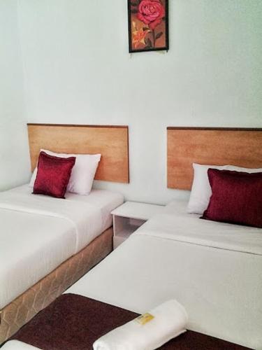 Ένα ή περισσότερα κρεβάτια σε δωμάτιο στο Rose Inn Motel