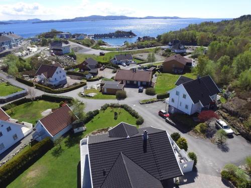 an aerial view of a house in a neighborhood at Family house close to the beach in Mosterhamn