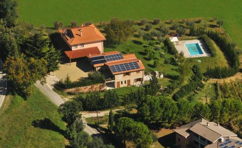 an aerial view of a house with solar panels on it at Angela Garden in Servigliano
