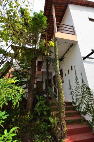 a house with stairs leading up to it at Doce Lar Hospedaria in Lençóis