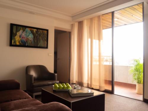 a living room with a couch and a table at Hotel Marbella in Mexico City