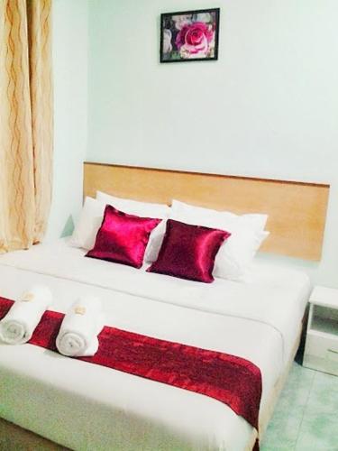 Ένα ή περισσότερα κρεβάτια σε δωμάτιο στο Rose Inn Motel
