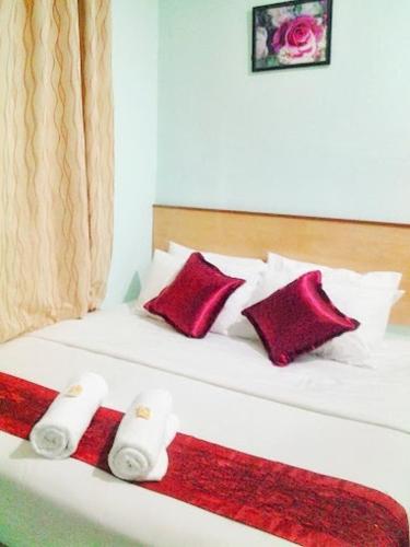 Ένα ή περισσότερα κρεβάτια σε δωμάτιο στο Rose Inn Motel