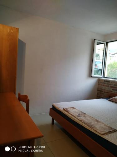 Ein Bett oder Betten in einem Zimmer der Unterkunft Apartments Simovic