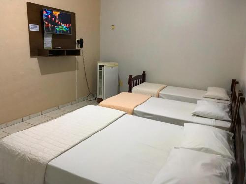 Katil atau katil-katil dalam bilik di Aki Hotel