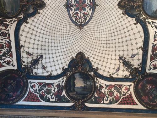 a wall with a bunch of mirrors on it at Casa Rattazzi in Turin