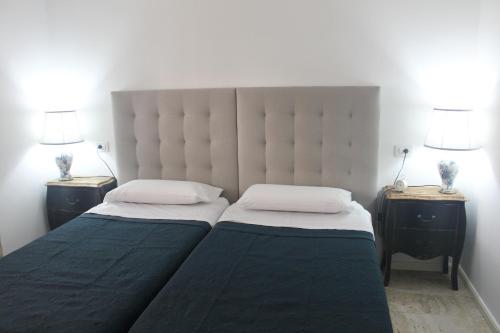 A bed or beds in a room at Magnifico apartamento en las dunas de corralejo